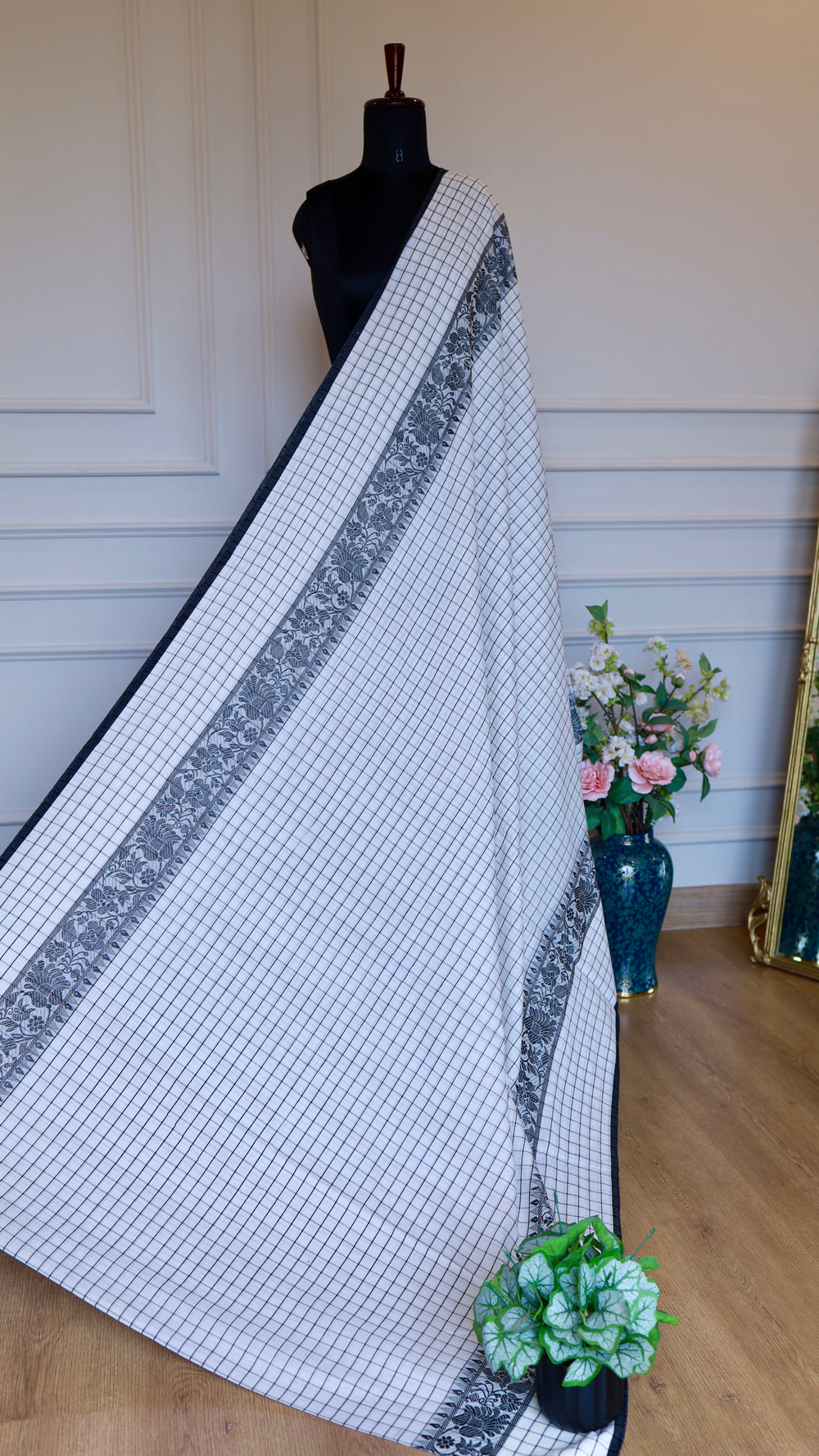 Wide shot of the elegant fall and drape of the Titafu Dhonekhali
collection.