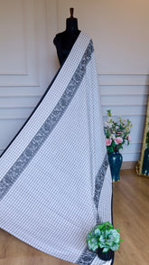 Wide shot of the elegant fall and drape of the Titafu Dhonekhali
collection.