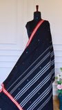 The Pallu of the Black Dhonekhali Saree featuring traditional horizontal white stripes and dense thread work patterns
