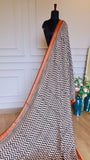 Front profile of the Handblock Printed Maheshwari Silk Saree displayed on a black boutique mannequin, demonstrating how the vertical chevron pattern elongates and flatters the silhouette.