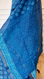 Detail shot of the inner pleat fabric of the blue Maheshwari silk saree featuring a fine turquoise dot pattern and hand-stamped geometric border.