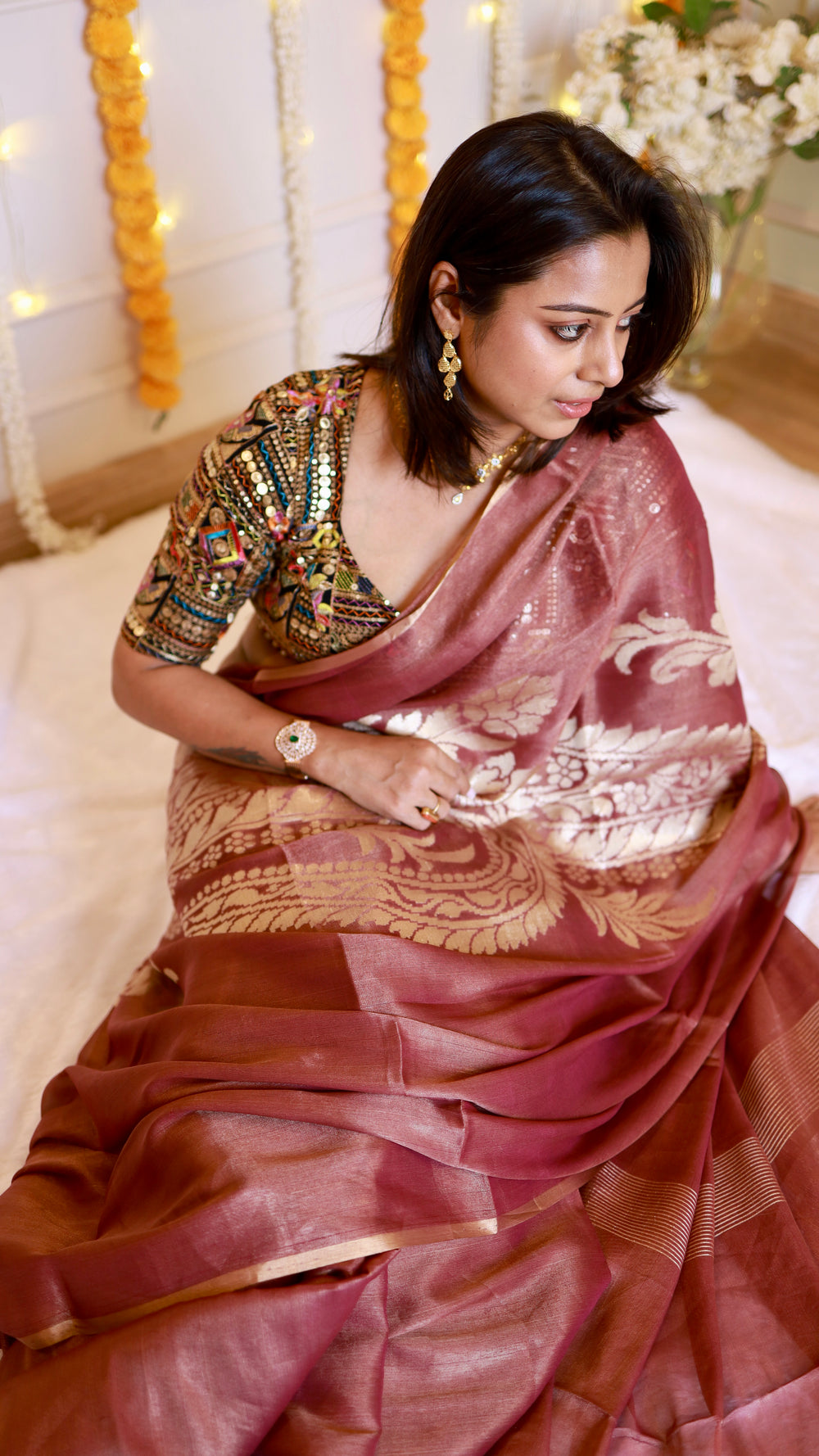 Front view of woman wearing Rosewood Mauve Pure Chiffon Tissue Silk Banarasi Saree paired with a black embroidered blouse.