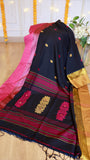Alt Text: Midnight black cotton Bomkai saree featuring crimson woven pallu motifs, gold zari border, and matching tassels on display