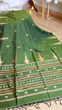 Direct view of the wide woven border on a green handwoven khadi cotton saree detailing geometric square borders and temple motifs.