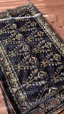 Full view of the grand pallu of the Black Kardana Jamdani Saree highlighting intricate tree-of-life geometric motifs and scalloped lace trim.