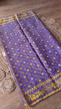 Full length view of the lavender Kardana Jamdani saree displayed flat showing all-over mustard yellow buttis and decorative lower border detailing.