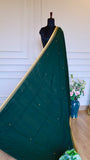 Full length drape of Emerald Green Dhonekhali Handloom Cotton Saree on a mannequin showing the elegant fall