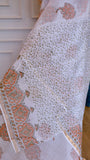 olded view of a White Kota Doria pure cotton saree displaying the intricate small floral-leaf all-over Bagru handblock print layout.