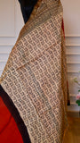 Close-up shot of the cream and black handblock printed section of the Titafu Maheshwari silk saree, showcasing intricate repeated leaf and floral bud motifs stamped with natural black dye.
