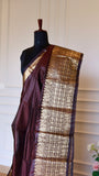 Upper torso drape shot showing the dark wine red Mangalagiri semi silk saree with broad golden zari border pleats