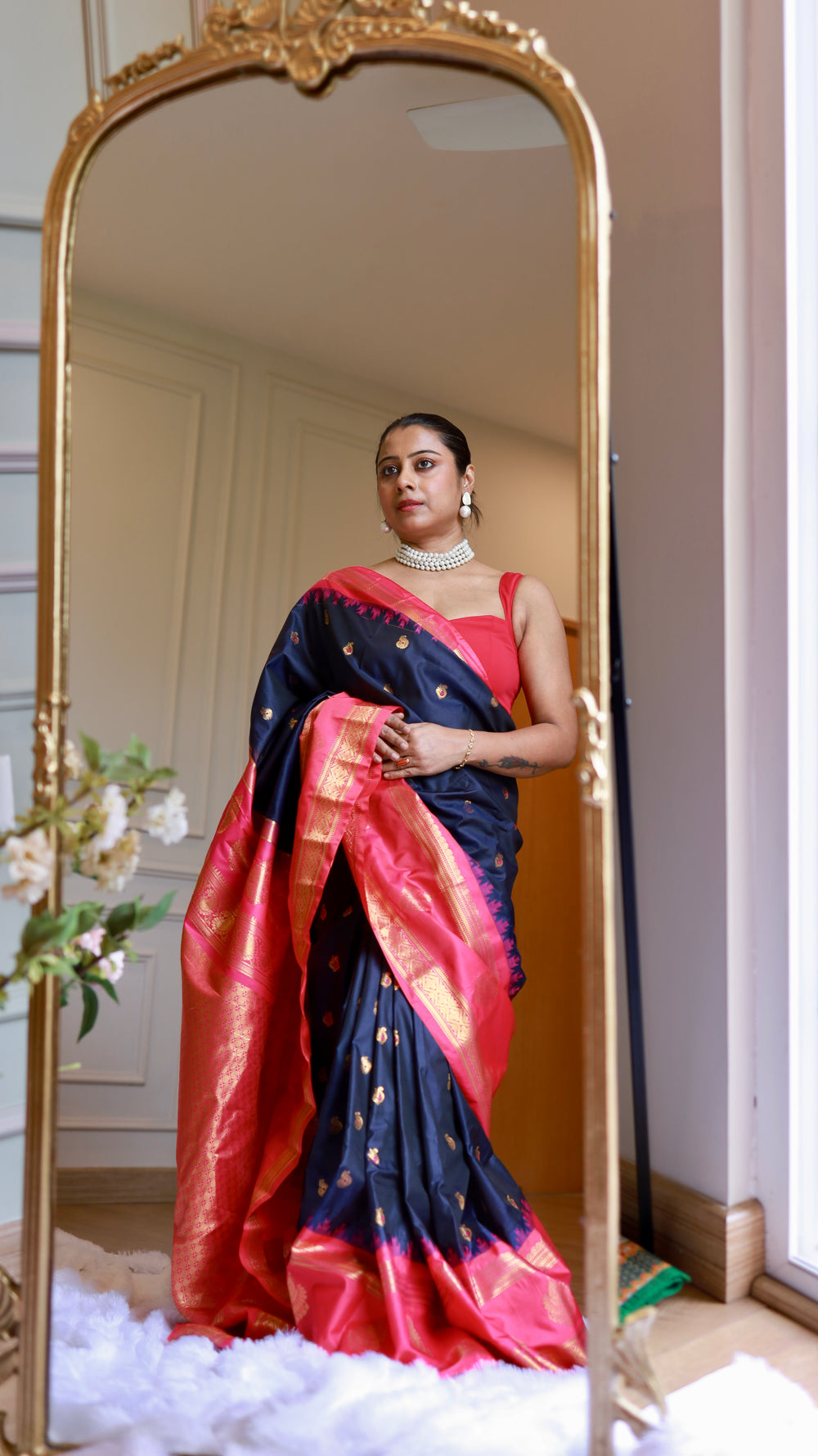 Royal navy blue semi Gadwal silk saree with rani pink zari border draped on model in full-length mirror view - Titafu Ethnic Wear