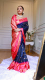 Model showcasing the drape and rich golden zari pallu detail of Titafu navy blue and pink semi Gadwal silk saree
