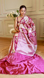 Side view highlighting the broad silver zari woven pallu and subtle sheen of the magenta Munga silk drape.