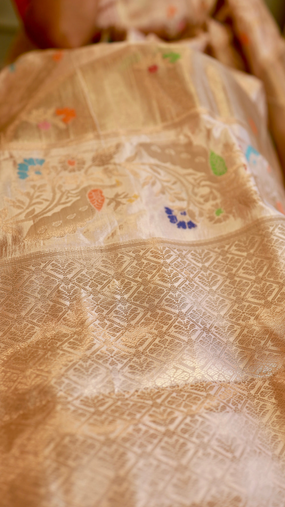 Detailed close-up of Munga Contrast Banarasi Saree showing gold zari grid weave and subtle multi-colored Meenakari motifs.