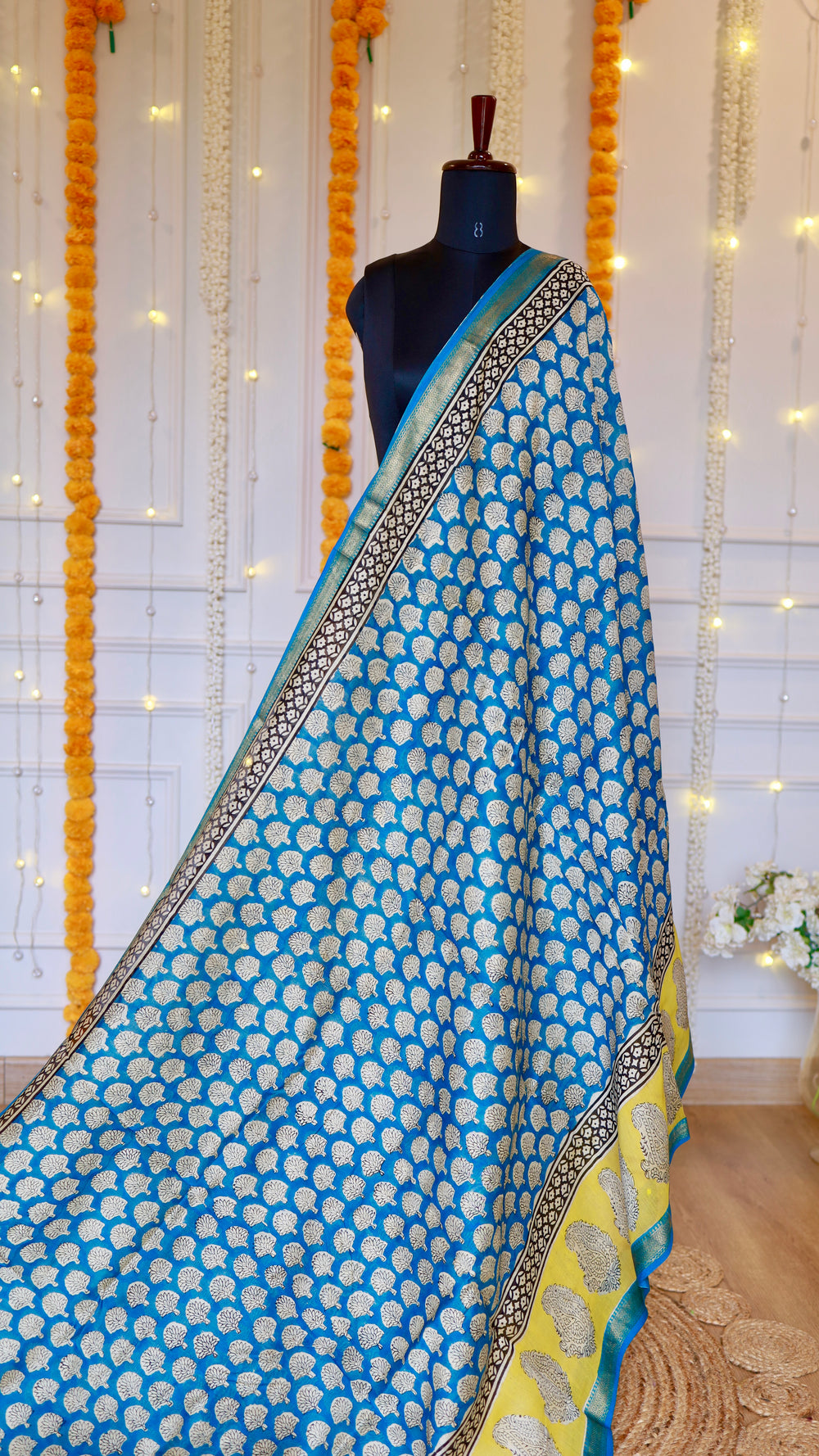 Full drape view of Cerulean Blue Maheshwari Silk Saree on mannequin showing small motif body print and contrasting yellow pallu.