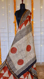 Handblock printed pallu featuring rust orange polka dots and black floral tile borders on Maheshwari silk saree