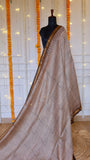 Full length view of beige hand block printed Maheshwari silk saree with fine wave lines and gold zari border