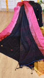 Detailed drape view of black cotton Bomkai saree showing vibrant magenta pink border weave and soft fabric texture