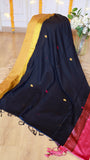 Full length view of black handloom saree highlighted with a wide mustard yellow zari border and pink accent pallu