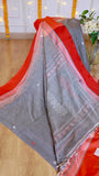 Draped grey cotton Bomkai saree with red contrast border and traditional extra-weft pallu design