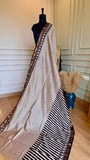 Full-length view of Titafu Maheshwari Silk Saree with ivory and black stripes displayed on a mannequin.