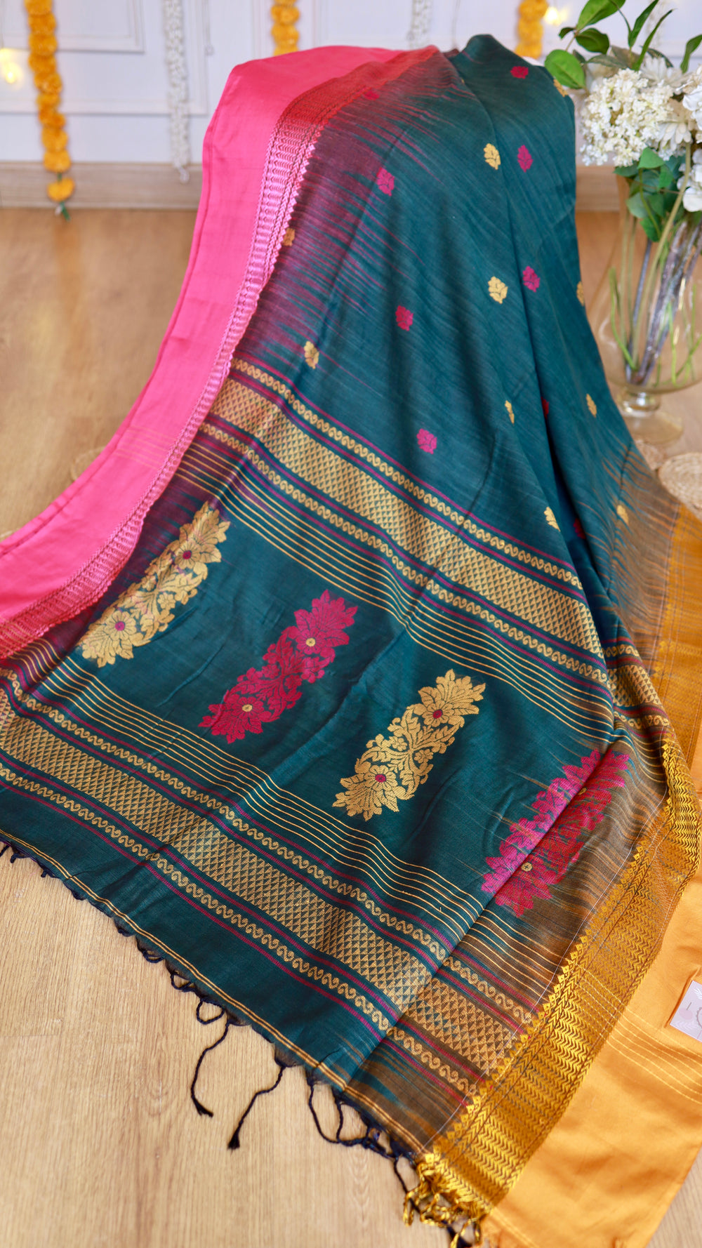 Full view of intricate extra-weft pallu design on Peacock Green and Rani Pink Cotton Bomkai Saree with zari work and tassels.