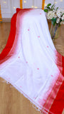 Close-up of off-white pure Cotton Bomkai Saree draped to showcase small pink buti motifs and red temple ikkat border