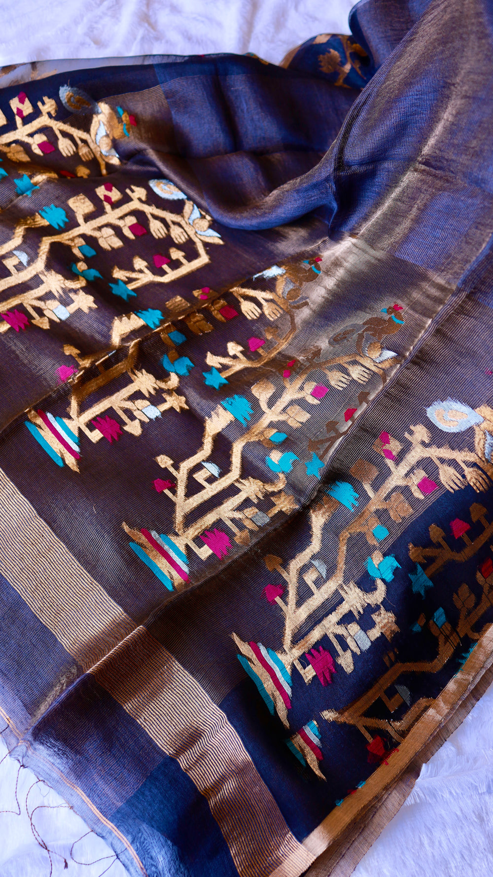 Full layout view of midnight blue pure silk linen saree pallu displaying dense handwoven golden tree motifs.