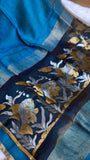 Detailed close-up of dark navy pallu with silver and gold aquatic zari weave on Pure Silk Linen Saree.