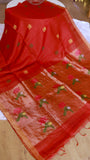 Close-up shot emphasizing the elegant drape and folds of the Scarlet Red Silk Linen Saree, contrasting with the detailed floral pallu.