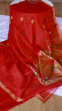 High-angle shot of the Red Silk Linen Saree showing the plain scarlet body and the start of the contrasting pallu with prominent pink Jamdani floral motifs.