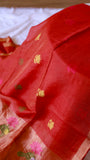 Close-up detail of the body of the Pure Silk Linen Saree in Red, highlighting the rich fabric texture and sparse gold floral buttas.