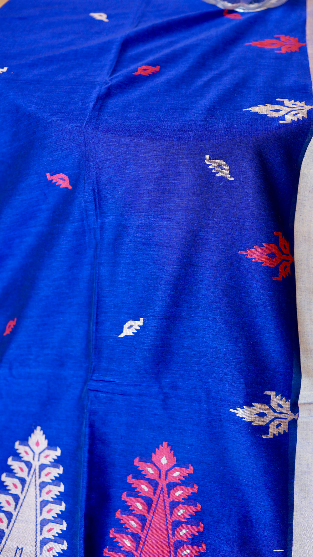 Texture shot of royal blue handwoven khadi cotton weave highlighting fine handloom craftsmanship
