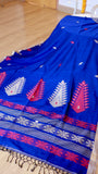 Royal blue handwoven khadi cotton saree displayed with pallu details and hand-knotted fringe tassels.