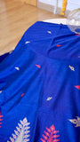 Royal blue handwoven khadi cotton saree showing close-up texture and red and white woven butis.
