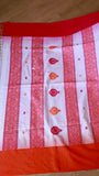 Flat lay overview showing the full width of the white Khadi Cotton Saree with distinct red geometric borders and matching red blouse piece material at the top.