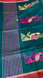 Close-up of the saree pallu (aanchal) section, highlighting the distinctive white and magenta pink vertical striped pattern next to the main green body.