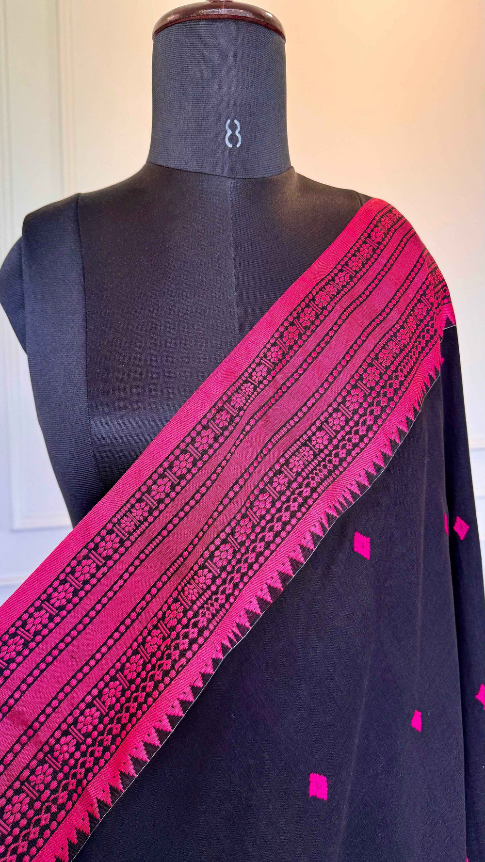 Jet Black Handloom Cotton Saree with Rani Pink Naga-Inspired Thread Work