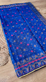 Full-length flat lay of the Royal Blue Kardana Jamdani Saree showcasing the all-over small floral bootis, wavy magenta lower border design, and sheer fabric texture.