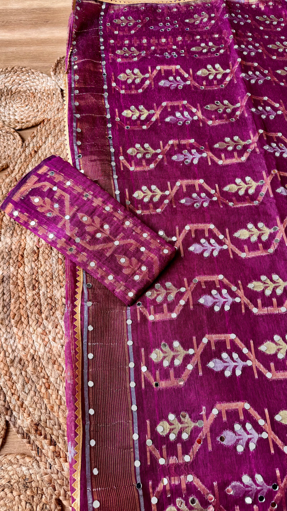 Magenta Kardana Jamdani Saree paired with its matching unstitched blouse piece displaying detailed mirror work and gold border trim.