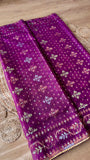 Close-up of Magenta Kardana Jamdani Saree body showing floral Jamdani motifs, subtle mirror work, and gold triangle lace edging.