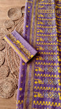 Detailed top-down shot of the lavender saree pallu alongside the matching folded blouse piece fabric featuring hand-embroidered border motifs.