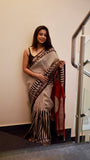 Frontal view of a model wearing a Titafu designer saree, showcasing the drape and professional ethnic styling.